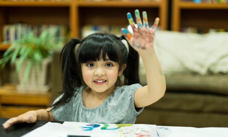 cheerful girl kid enjoy color painting with creativity ideas present messy hand home 1 WingsMyPost