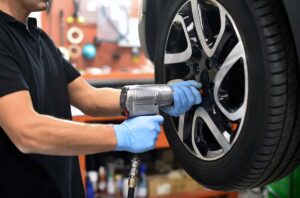 mechanic changing a tyre WingsMyPost