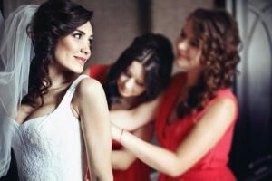 bridesmaids red dresses help beautiful bride prepare her wedding 1304 3971 WingsMyPost