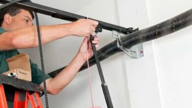 Garage door repair service in Maryland, showcasing a technician fixing a residential garage door.